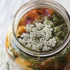 a jar filled with food sitting on top of a table