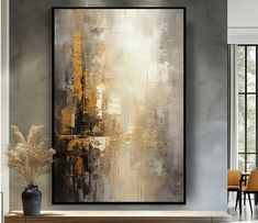 an abstract painting hangs on the wall above a wooden table in a modern living room