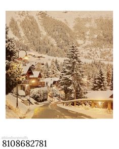 a snow covered mountain with houses and trees in the foreground is an advertisement for a real estate