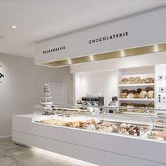 a bakery filled with lots of different types of pastries and desserts on display