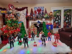 a living room filled with christmas decorations and toys