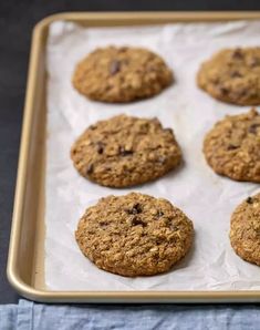 six cookies on a baking sheet ready to be baked in the oven or used as an appetizer