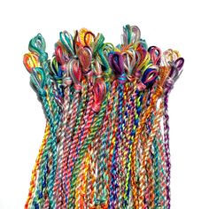 multicolored braids are lined up on top of each other