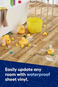 a bathroom with rubber ducks on the floor and bathtub full of waterpooing