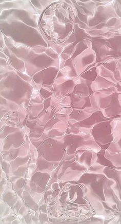 the water is very clear and pink in this photo, it looks like they are floating