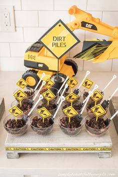 construction themed dessert table with dirt piles