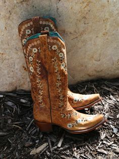 Expertly crafted with a stunning floral embroidery, Women's Cognac Flowered Embroidered Glow Cowboy Boot is a showstopper. With high-quality leather, these boots provide long-lasting comfort and style. Perfect for adding a touch of western glamour to any outfit. 2' heel with a leather sole. The stitching glows in the dark; not the leather. Are you a fan of simplicity? Well, you're in luck because these boots are a breeze to care for! When it comes to maintaining your boots, we recommend Fiebings Dark Cowboy, Womens Cowboy Boots, Corral Boots Womens, Cowboy Boot Outfits, Boys Cowboy Boots, Flower Boots, Boot Outfits, Girl Cowboy Boots, Lucchese Boots