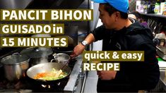 a man cooking in a kitchen with the words pancit bihon gusado'n 15 minutes quick & easy recipe