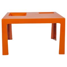 an orange plastic table with two bins on the top and one at the bottom