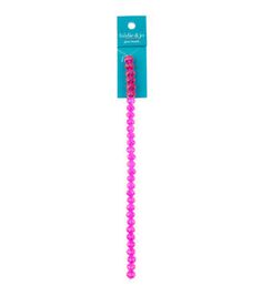 a pink plastic toothbrush on a white background