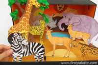 an open cardboard box with animals and giraffes