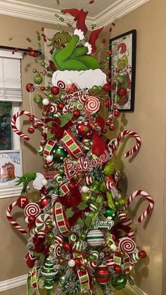 a christmas tree decorated with candy canes and candies