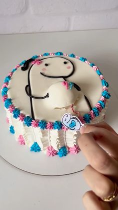 a cake with a stethoscope on it is being held by a person