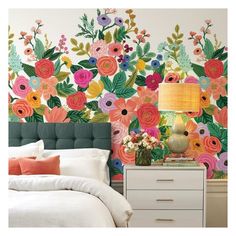 a bedroom with flowers painted on the wall