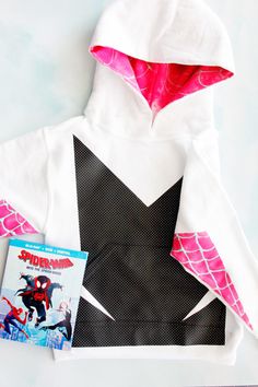 the hoodie is made out of paper and has spider - man on it