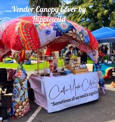 vendor canopy covered by hippiewud at an outdoor market