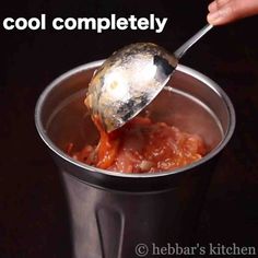 someone is spooning some food out of a black cup with the words cool completely on it