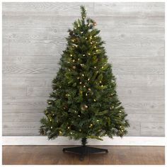 Add a dazzling focal point to your holiday celebrations with this Yuletide Pine Pre-Lit Christmas Tree! This festive Christmas tree is adorned with warm white LED lights that have a steady glow when plugged into a wall outlet, as well as small pinecones scattered throughout. Some of its branches feature fine needles at their tips, while others have flat needles, and the shade of green between the two is varied. Its moderate height makes it perfect for smaller spaces or for setting on a raised su Best Artificial Christmas Trees, Frasier Fir, Pine Christmas Tree, Warm White Led Lights, Pre Lit Christmas Tree, Tinsel Garland, Wall Outlet, Holiday Display, Faux Tree