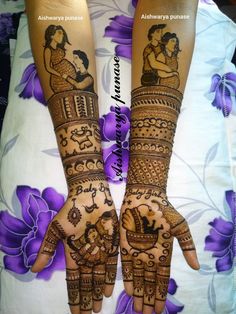 two hands with henna designs on them