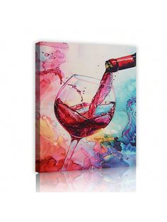 a wine glass with red wine being poured into it on a colorful background canvas wall art print