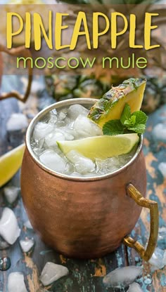 the pineapple moscow mule is garnished with mint and lime