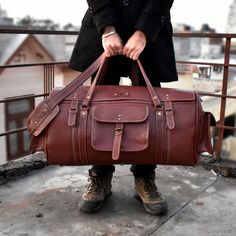 Genuine Leather Duffel Bag for Travel and Adventure Leather Handmade Duffle bag Full-Grain Leather Weekender Duffel Bag Have you ever wondered what makes the ideal travel partner? It would help if you looked no farther than our opulent brown handmade full-grain leather weekender duffel bag. These are the reasons it's essential:  -Premium Material: Made to last from thick, real leather.  -Easy Organization: Separate sections for shoes and underwear.  -Size Options: To accommodate any trip, 24", 2 Rectangular Leather Weekender Bag For Travel, Leather Lined Travel Shoulder Bag, Travel Duffle Bag With Leather Lining, Daily Use Leather-lined Rectangular Duffle Bag, Leather-backed Duffle Shoulder Bag For Travel, Rectangular Bags With Leather Lining For Overnight Trips, Brown Shoulder Bag For Overnight Trips, Weekend Satchel Bag With Leather Backing, Leather Lined Tote Bag For Overnight Trips