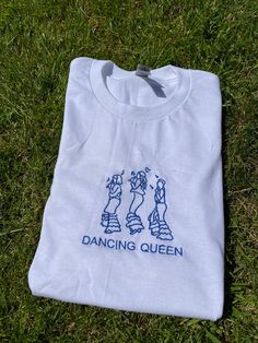 Dancing Queen embroidered design t shirt! Perfect for Mamma Mia fans, to wear all summer! Design is available in both baby tee and standard t-shirts (please refer to the size guides if you are unsure on size)! Also available to order as a sweatshirt here: https://mentallyunstitched.etsy.com/listing/1598037825 All orders are made within 1-3 week. T shirt: 100% cotton Unisex design, great for everyone! Mamma Mia Shirt, Embroidered T Shirt, Dancing Queen, Summer Design, Embroidered Tshirt, Design T Shirt, Embroidered Shirt, Embroidered Design, Baby Tee