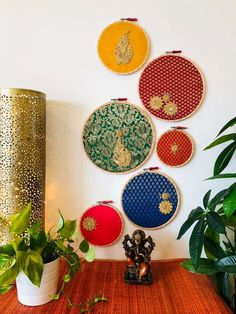 the wall is decorated with many different types of embroiderys on it, including gold and red