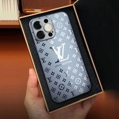 someone is holding up their louis vuitton iphone case in the box for display