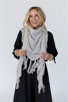 Drape yourself in the Moon Shadows Ruana Wrap and feel stylishly boho from day to night! This cozy-knit wrap features a loose and flowy silhouette, a beautiful triangular shape, and adorable tassel trim for a unique and versatile look. Infuse your wardrobe with some boho flair! Details: One size: 33 1/2"W x 86"L 100% Acrylic Hand wash cold, Lay flat to dry Import Bohemian One Size Knit Shawl, Bohemian Knit Shawl One Size, Bohemian One-size Knit Shawl, Casual One Size Fringe Shawl, Casual One-size Shawl With Fringe, Bohemian Knit Shawl, Bohemian Fringe Scarves For Winter, Bohemian Fall Scarves With Tassels, Cozy Fringed Scarves For Fall