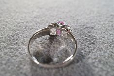 I am offering you this vintage sterling silver (stamped) ruby band ring. It features an oval shaped prong set genuine ruby stone. It is currently a size 9, though I am sure this could easily be sized up or down. It measures approx. 3/4 inch, by app 1/4 inch, and weighs 4 grams. This is a must have to add this to your jewelry collection. Buyer pays shipping and handling. Vintage Three Stone Birthstone Ring For Gift, Vintage Three Stone Birthstone Ring As Gift, Vintage Three-stone Ruby Ring Gift, Vintage Three Stone Ruby Ring Gift, Vintage Three Stone Ruby Promise Ring, Vintage Oval Three-stone Ruby Ring, Collectible Oval Ruby Ring In Silver, Silver Three-stone Ruby Ring, Silver Ruby Ring With Three Stones