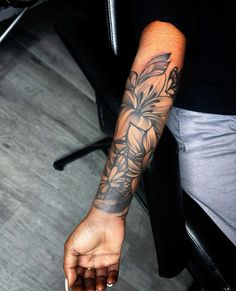 a person with a flower tattoo on their arm