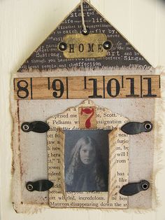 an altered photo frame with the word home on it