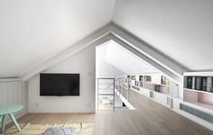 a room with white walls and wooden floors