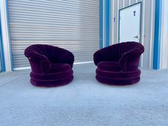 two purple chairs sitting next to each other