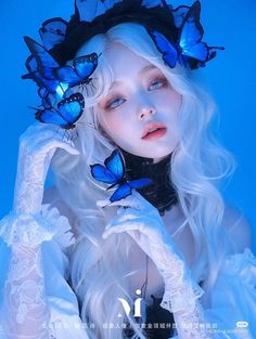 a woman with white hair and blue butterflies on her head is posing for the camera