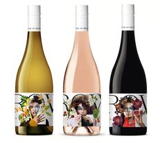 three bottles of wine, one with a woman's face and the other with flowers