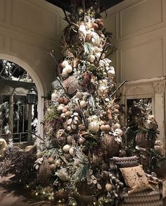 a decorated christmas tree in the middle of a room