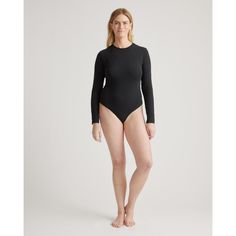 Modern and timeless, this versatile base layer can be easily dressed up or down in a snap. Slip it on under our Washable Silk Skirt for a simple wow factor or pair it with jeans for a casual, laidback look. With full coverage and supportive stretch, our Everyday Cotton Long Sleeve Crewneck Bodysuit checks all the boxes.  | Quince | Women's Everyday Cotton Long Sleeve Crewneck Bodysuit in Black, Size XS, Nylon Black Bodysuit Longsleeve, Silk Tee, High Neck Bodysuit, Scoop Neck Bodysuit, Cami Bodysuit, Jersey Long Sleeve, Black Seamless, Cotton Bodysuit, Women Rising