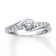 a white gold ring with diamonds on it