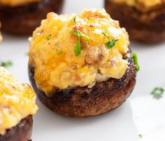 baked stuffed mushrooms with parmesan cheese and chives on a baking sheet, ready to be eaten