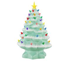 a white ceramic christmas tree with multicolored lights