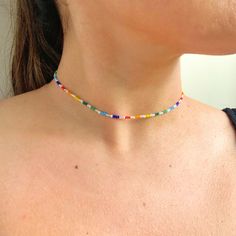 Click here for this dainty seed bead rainbow necklace. This handmade mixed color seed bead necklace is everything you need to show your pride. 🏳️🌈This necklace includes an assortment of small seed beads. The necklace can be purchased in different lengths to go perfect with your look. The necklace includes an extender that allows for you to layer it perfectly with all of your necklaces. The listing is for a single beaded necklace. Shop our matching anklet: https://www.etsy.com/listing/130553825 Minimalist Bead Necklace, Rainbow Heart Beads Jewelry, Adjustable Rainbow Necklace With Colorful Beads, Dainty Multicolor Necklace For Jewelry Making, Minimalist Multicolor Beaded Chain Necklace, Rainbow Necklaces With Tiny Round Beads, Colorful Beaded Necklaces With Letter Beads, Rainbow Necklace With Tiny Round Beads, Dainty Multicolor Necklaces With Spacer Beads