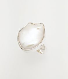 This unique handcrafted  Sterling Silver ring,hang a white natural baroque pearl with rear natural beauty.  The materials we used to create this unique ring are: Silver (925) Silver (999) and mineral stones (exclusively). The selected gemstone for PURITY collection is pearl.  Pearl is a pure gemstone and a timeless, elegant choice for every type of woman. As a symbol of femininity, we have designed this collection keeping in mind that women want to maintain this purity and innocence in order to White Sterling Silver Rings With Pearl Drop, Unique White Pearl Ring As Gift, Elegant Teardrop Natural Stone Rings, Unique White Pearl Ring, Unique Oval White Pearl Ring, White Oval Pearl Drop Rings, White Baroque Pearl Rings For Anniversary, Unique White Oval Pearl Ring, White Wedding Rings With Natural Stones