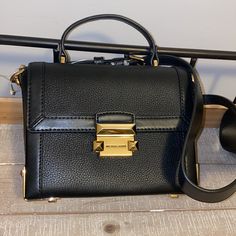 Absolutely Stunning Black And Gold Bag, Brand New With Tags! Black Crossbody Box Bag With Branded Hardware, Luxury Black Box Bag With Metal Hardware, Michael Kors Top Handle Bag For Work, Black Box Bag With Branded Hardware For Everyday, Everyday Black Box Bag With Branded Hardware, Elegant Michael Kors Shoulder Bag For Work, Michael Kors Black Shoulder Bag For Work, Michael Kors Black Workwear Bag, Michael Kors Workwear Bag With Adjustable Strap