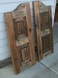 two wooden doors sitting next to each other