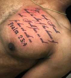 a close up of a man's chest with some writing on his chest and the words written in cursive font