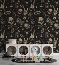 the wallpaper is decorated with skulls and guitars