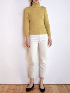 Cool vintage turtleneck blouse made of wool blend fabric with ribbed texture in muted yellow beige tone. Classic long sleeve body-hugging cut. Era: 90's, brand Elizabeth Shelton Fabric: 20% wool, 80% acrylic Condition: very good Estimated size: S / M (please, check the measurements) Measurements (measured flat, without stretching. Item is very stretchy): Chest: 44 cm / 17,3 inches Length: 60 cm / 23,6 inches Beige Fitted High Neck Sweater, Fitted High Neck Beige Sweater, Beige Fitted Turtleneck Sweater, Spring Turtleneck Sweater, Fitted Beige Turtleneck Sweater, Beige Fitted Crew Neck Sweater, Fitted Beige Crew Neck Sweater, Spring Workwear Long Sleeve Turtleneck, Fitted Cotton Turtleneck With Long Sleeves