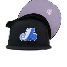 New Era Cap 59Fifty fitted hat for the Montreal Expos in black and blue colorway, featuring 1982 All Star Game side patch. We’ve taken our famous WAVE fitted and made a few revisions to make it even more fabulous. We’ve replaced Cerulean Blue with a softer Ultra Blue, which plays perfectly against the sharp Marine Blue embroidery. Our favorite part? The colors work perfectly in making the 1982 All Star Game side patch seem proportionate in size due to the two similar shades of blue playing so pe Blue Fitted Hat With Embroidered Logo For Streetwear, Blue Baseball Cap With Logo Patch, Blue Fitted Hat With Logo Patch And Flat Bill, Blue Flat Bill Fitted Hat With Logo Patch, Throwback Black Baseball Cap With Flat Bill, Blue Logo Patch Baseball Cap, Blue Fitted Baseball Cap With Logo Patch, Throwback Black Flat Bill Baseball Cap, Black Six-panel Snapback Hat For Fans